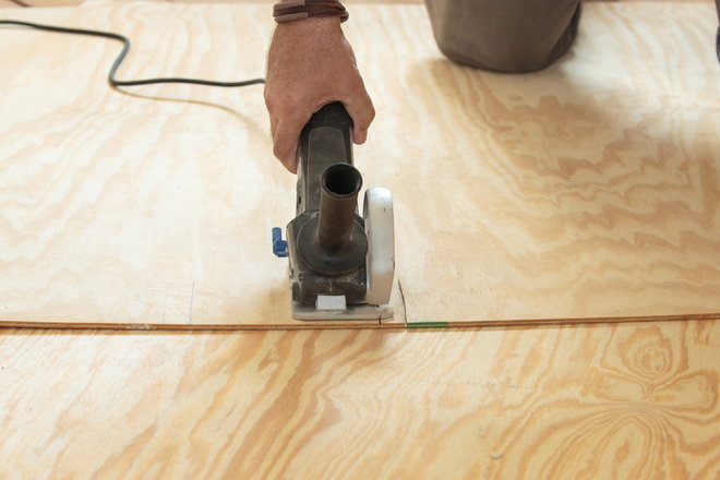 cutting through a piece of plywood