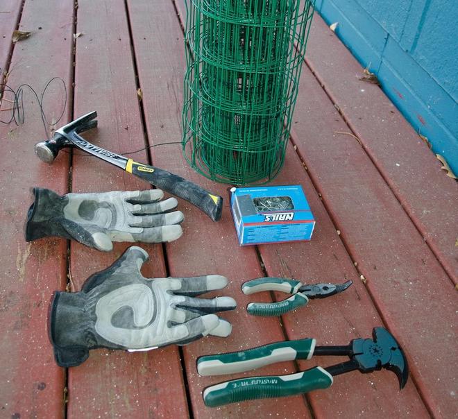 fencing supplies laid out on a deck