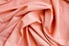 bunched-up pink viscose fabric