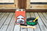 Paint removing supplies on a wooden deck.
