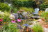 Pond surrounded by seating and colorful plants