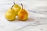 Three pears on a marble counter