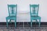 A set of blue shabby chic chairs.
