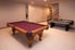 A rec room with a pool and air hockey table.