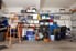Wall of garage items on floor and shelving
