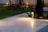 lit and landscaped stone driveway