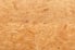 A close look at the texture of oriented strand board.