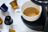 A Keurig coffee machine brewing coffee into a mug