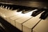 A close up on piano keys.