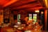 Interior view of a lavishly furnished log home.