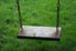 Wooden Swing with grass underneath
