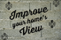 The phrase, "Improve your home's view" on a cinderblock brick wall