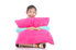 A girl hugging a large pink pillow.