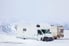 Two RVs in the snow.