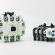 Two magnetic contactors on a white background.