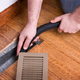 Heating Vent Air Duct Getting Cleaned
