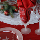 etched glasses and plate on a table set for Christmas