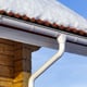 gutter, downspout, and snowy roof