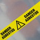 A sign that says "danger asbestos."