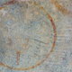 circular rust stain on concrete ground