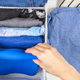 folding clothes in a small drawer