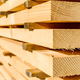 A close-up of stacked lumber.