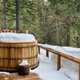 cedar hot tub on a deck in the snow