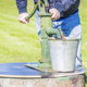 A man uses a well.