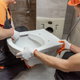 two workers installing a bidet