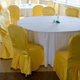 chairs with gold slipcovers around white dining tables