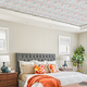 A bedroom with a wallpaper statement ceiling