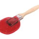 A paint brush coated in red lacquer paint.