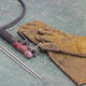 Welding supplies including gloves and electrodes.