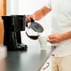 A man pours coffee.
