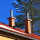roof with chimneys and an aluminum gutter