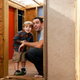 A father and son in a new, backyard playhouse