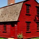 small red house with wide gambrel roof