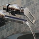 Bathtub waterfall faucet with water pouring out