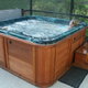 A woman sitting in a hot tub with the blowers on.
