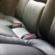 The back seat of a car upholstered in vinyl.