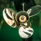 silver boat propeller attached to green boat