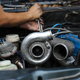 a person working on a Turbo Diesel Engine