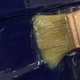 paintbrush applying gel coat