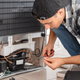 Man repairing refrigerator