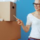 woman with boxes and clipboard preparing for a move