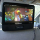 portable DVD player playing a movie in a car