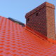 Roof flashing on a red roof.