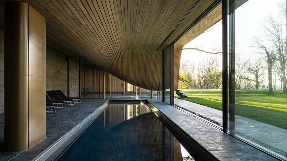 The Fold House's crazy sloping form is perhaps best seen in the ceiling just above the swimming pool. 