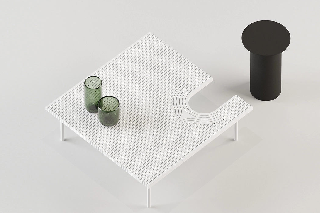 A small white table and bold black stool featured in designer Dmitry Kozienko's 
