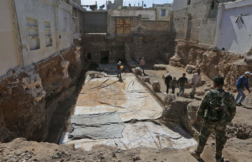 The Roman mosaic remains covered as workers continue to excavate new sections.